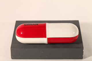 A pill-like eyeglasses case printed with CONAN LOGO, with a novel design, small and cute
