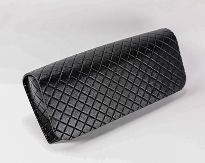 A Black Eyeglass Case with Diamond Lines Printed on It, Which Looks Like A Wallet